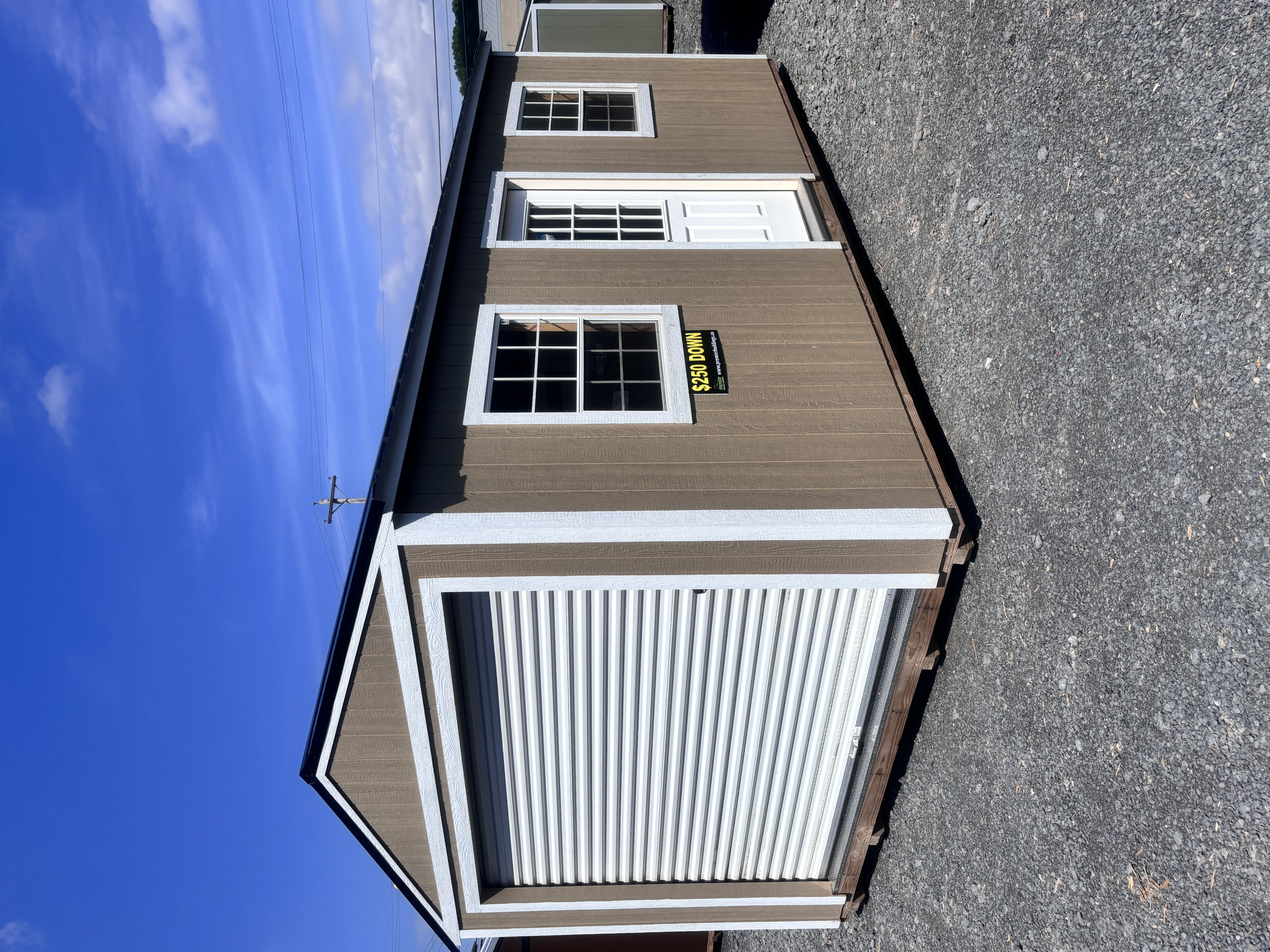 Lineup of Premier Portable Buildings on the Beaver Dam sales lot